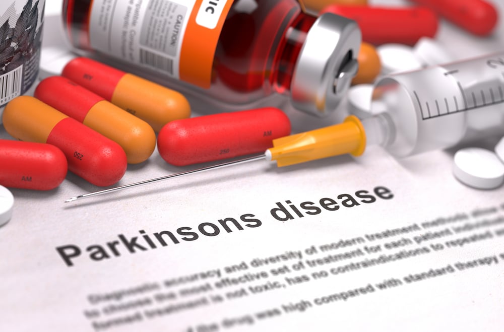 Diagnosis - Parkinsons Disease. Medical Concept with Red Pills, Injections and Syringe. Selective Focus. 3D Render.
