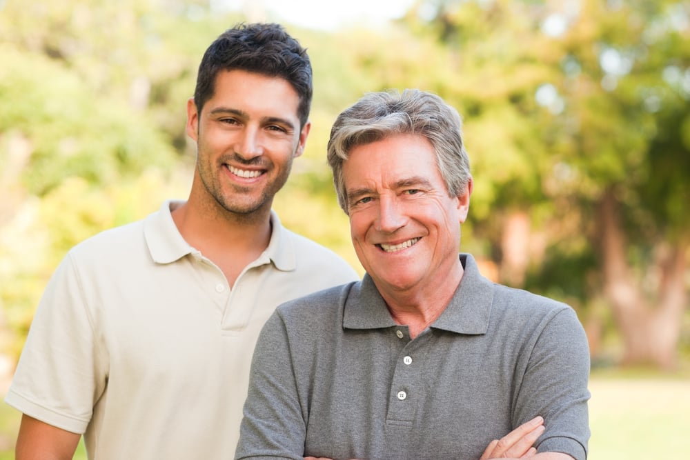 Father and his son looking at the camera Father and his son looking at the camera